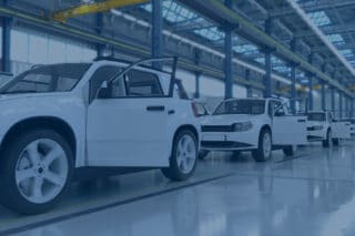 White cars in the factory with blue filter