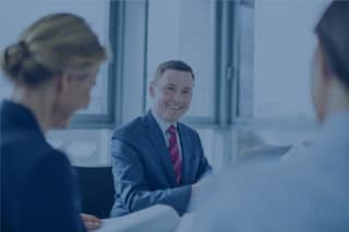 Businesspeople meeting in the conference room with blue filter